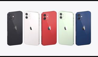 This image provided by Apple shows a display of the new iPhones equipped with technology for use with faster new 5G wireless networks that Apple unveiled Tuesday, Oct. 13, 2020. (Apple via AP)