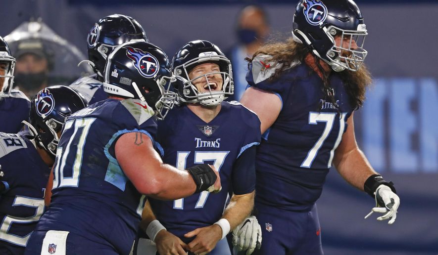 Tennessee Titans quarterback Ryan Tannehill (17) celebrates after scoring a touchdown on a 10-yard run against the Buffalo Bills in the first half of an NFL football game Tuesday, Oct. 13, 2020, in Nashville, Tenn. (AP Photo/Wade Payne)