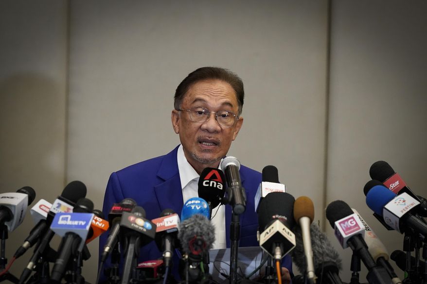 Malaysian opposition leader Anwar Ibrahim speaks during a press conference after meeting the nation&#39;s king in Kuala Lumpur, Malaysia, Tuesday, Oct. 13, 2020. Anwar met the king Tuesday in a bid to form a new government after claiming he had secured a majority in Parliament. (AP Photo/Vincent Thian)