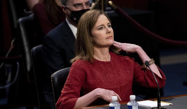 Supreme Court nominee Amy Coney Barrett listens during a confirmation hearing before the Senate Judiciary Committee, Tuesday, Oct. 13, 2020, on Capitol Hill in Washington. (Erin Schaff/The New York Times via AP, Pool)