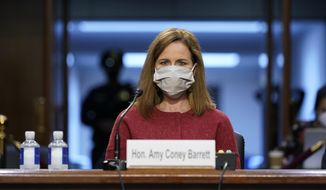 Supreme Court nominee Amy Coney Barrett listens during a confirmation hearing before the Senate Judiciary Committee, Tuesday, Oct. 13, 2020, on Capitol Hill in Washington. (AP Photo/Susan Walsh, Pool)