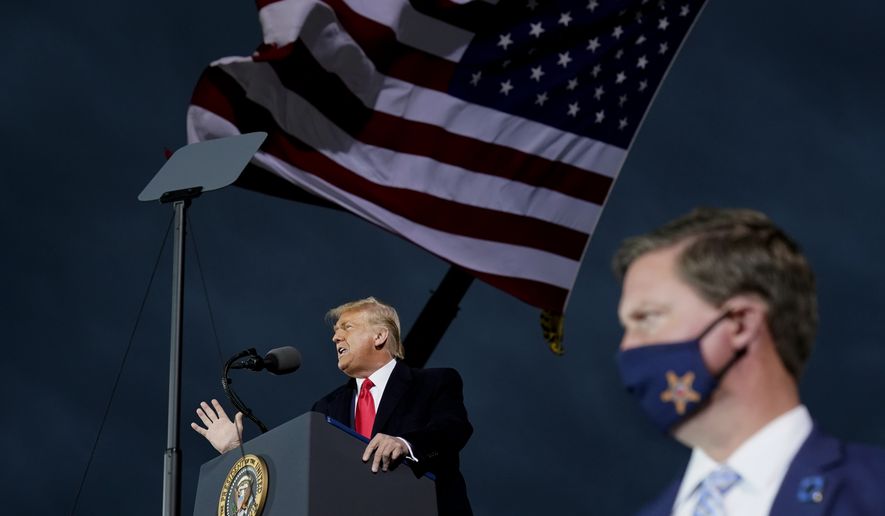 President Donald Trump speaks at a campaign rally at Des Moines International Airport, Wednesday, Oct. 14, 2020, in Des Moines, Iowa. (AP Photo/Alex Brandon)