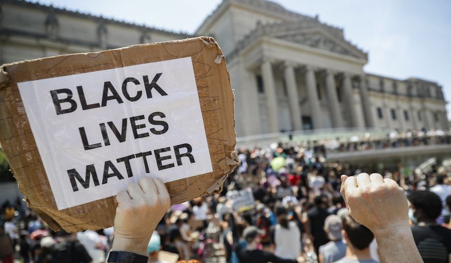 In this June 19, 2020, file photo, a protester holds a sign that reads &quot;BLACK LIVES MATTER&quot; during a Juneteenth rally outside the Brooklyn Museum in the Brooklyn borough of New York. Juneteenth commemorates when the last enslaved African Americans learned they were free 155 years ago. New York Gov. Andrew Cuomo signed legislation Wednesday, Oct. 14, 2020, officially making Juneteenth a New York state holiday. Although President Abraham Lincoln issued the Emancipation Proclamation on Jan. 1, 1863, it wasn&#x27;t until June 19th, 1865, that enslaved people in Galveston, Texas, found out about it from Union army personnel, making them among the last to know about their freedom. (AP Photo/John Minchillo, File)