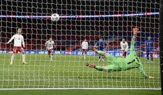 Denmark&#39;s Christian Eriksen, left, scores his team&#39;s first goal from the penalty spot during the UEFA Nations League soccer match between England and Denmark at Wembley Stadium in London, England, Wednesday, Oct. 14, 2020. (Daniel Leal-Olivas/Pool via AP)