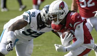 Arizona Cardinals wide receiver DeAndre Hopkins, right, runs past Carolina Panthers defensive tackle Kawann Short during the second half of an NFL football game Sunday, Oct. 4, 2020, in Charlotte, N.C. (AP Photo/Mike McCarn)