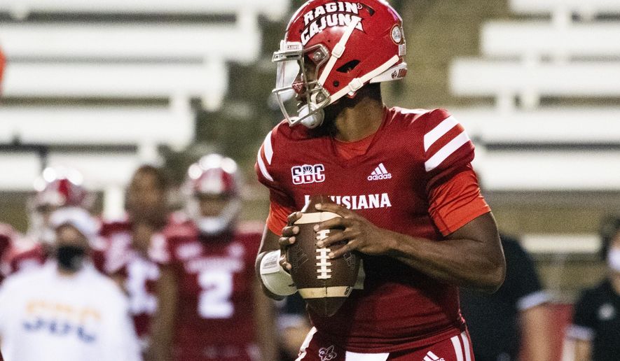 Louisiana-Lafayette quarterback Levi Lewis (1) drops back to attempt a pass during the first half of an NCAA football game against Coastal Carolina in Lafayette, La., Wednesday, Oct. 14, 2020. (AP Photo/Paul Kieu)