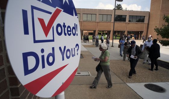 Voters line up outside to cast ballots in the general election at the Henrico County general registrar&#39;s office in Henrico County, Va., Friday, Sept. 18, 2020, on the first day of the state&#39;s 45-day early voting period. (Bob Brown/Richmond Times-Dispatch via AP) **FILE**