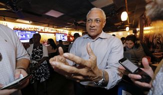 Mike Espy speaks to reporters, in Jackson, Miss., prior to winning the Democratic nomination for a U.S. Senate seat in Mississippi, Tuesday, March 10, 2020. After his victory Tuesday, he will face Republican incumbent U.S. Sen. Cindy Hyde-Smith and Libertarian candidate Jimmy Edwards in November. (AP Photo/Rogelio V. Solis)