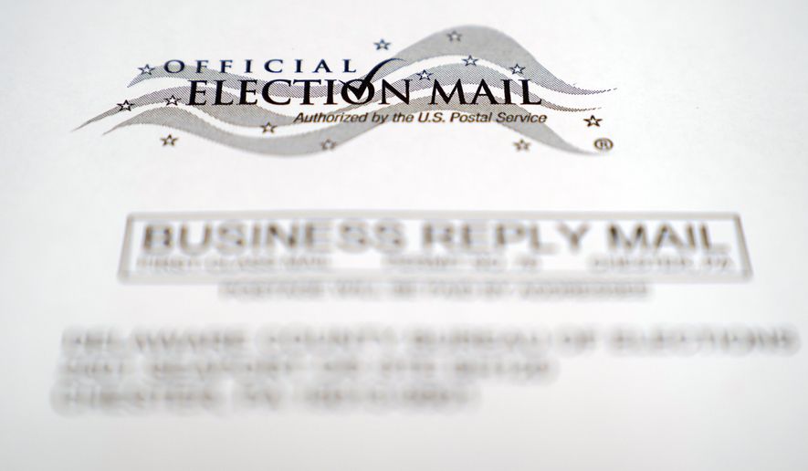 An envelope of a Pennsylvania official mail-in ballot for the 2020 general election is shown, Tuesday, Oct. 13, 2020, in Marple Township, Pa. More than 2.6 million registered Pennsylvania voters have applied for a mail-in ballot as of Tuesday, three weeks before the Nov. 3 presidential election. (AP Photo/Matt Slocum)