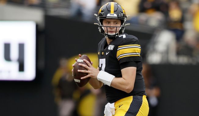 FILE - In this Sept. 28, 2019, file photo, Iowa quarterback Spencer Petras throws a pass during the second half of an NCAA college football game against Middle Tennessee in Iowa City, Iowa. Petras, who&#x27;ll replace three-year starting quarterback Nate Stanley, couldn&#x27;t walk into a much better situation. The 6-foot-5, 231-pound sophomore from San Rafael, California, will have plenty of experience around him at all positions, including what could be the best group of receivers in coach Kirk Ferentz&#x27;s 22 seasons.(AP Photo/Charlie Neibergall, File)