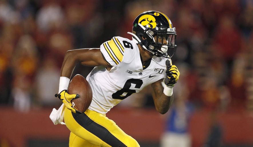 FILE - In this Sept. 14, 2019, file photo, Iowa wide receiver Ihmir Smith-Marsette returns a kickoff during the second half of an NCAA college football game against Iowa State in Ames, Iowa. (AP Photo/Charlie Neibergall, File)
