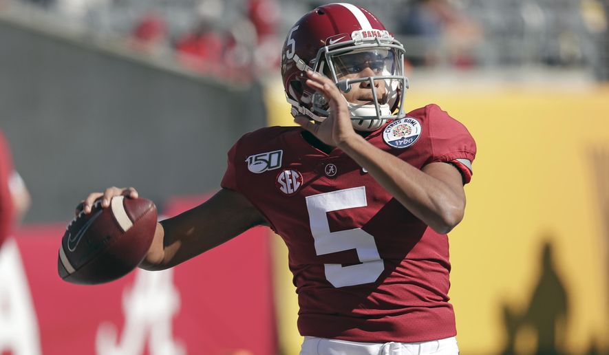 FILE - In this Jan. 1, 2020, file photo, former Alabama quarterback Taulia Tagovailoa warms up before the Citrus Bowl NCAA college football game against Michigan in Orlando, Fla. As head coach Michael Locksley enters his second season as the helm, he deals with quarterback Josh Jackson opting out of the 2020 season because of the COVID-19 pandemic and Tyrrell Pigrome has transferred to Western Kentucky. Tagovailoa, an Alabama transfer, and redshirt freshman Lance Legendre have been competing for the starting spot this fall.(AP Photo/John Raoux, File)
