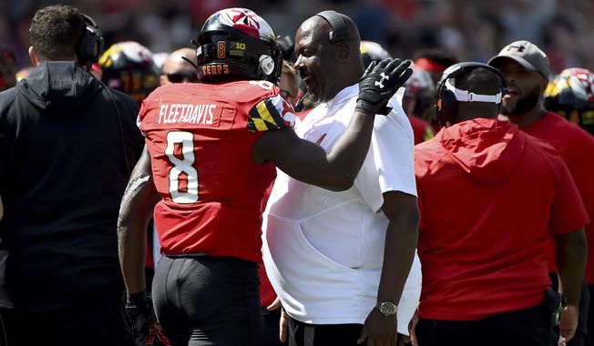 FILE - In this Sept. 7, 2019, file photo, Maryland running back Tayon Fleet-Davis (8) celebrates with head coach Michael Locksley after scoring a touchdown against Syracuse during the second half of an NCAA college football game in College Park, Md. Fleet-Davis and Jake Funk will likely receive the brunt of the carries, at least at the season&#x27;s outset. Fleet-Davis, a senior, has 589 yards in offense and 10 touchdowns. Funk has 31 games of experience despite missing the final nine games in 2019 with a knee injury. Moreover, as Locksley enters his second season as the helm, he deals with quarterback Josh Jackson opting out of the 2020 season because of the COVID-19 pandemic and Tyrrell Pigrome has transferred to Western Kentucky. Alabama transfer Taulia Tagovailoa and redshirt freshman Lance Legendre have been competing for the starting spot this fall. (AP Photo/Will Newton, File)