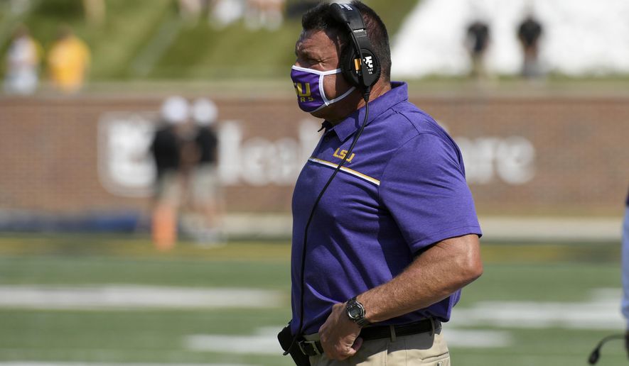 LSU head coach Ed Orgeron watches from the sidelines during the first half of an NCAA college football game against Missouri Saturday, Oct. 10, 2020, in Columbia, Mo. (AP Photo/L.G. Patterson)