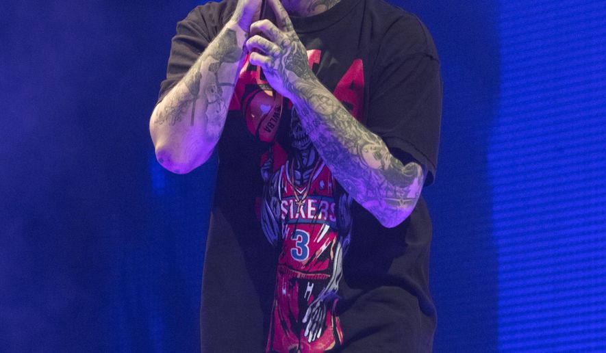 FILE - Post Malone performs during his "Runaway Tour" in Philadelphia on Feb. 21, 2020. Malone, who is nominated for 16 2020 Billboard Music Awards, will perform at the awards show airing Wednesday night on NBC at 8 p.m. ET from the Dolby Theatre in Los Angeles. (Photo by Owen Sweeney/Invision/AP, File)