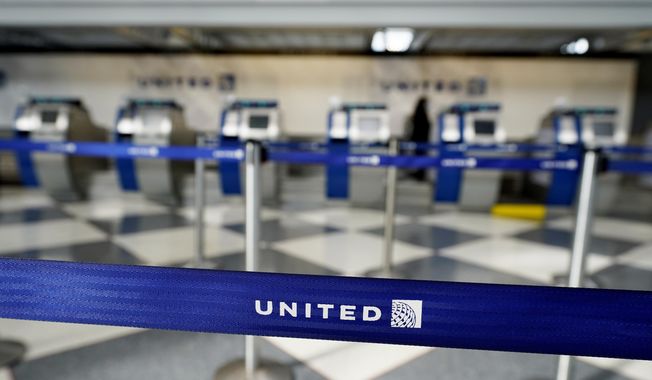 Empty ticketing counters are seen in Terminal 1 at O&#x27;Hare International Airport in Chicago, Wednesday, Oct. 14, 2020. United Airlines, which furloughed 13,000 employees this month, is expected to report a large third-quarter loss as the coronavirus pandemic continues to batter air travel. (AP Photo/Nam Y. Huh)