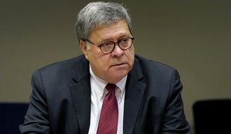 U.S. Attorney General William Barr meets with members of the St. Louis Police Department Thursday, Oct. 15, 2020, in St. Louis. The officers are among several in the department who have been shot in the line of duty this year. (AP Photo/Jeff Roberson, Pool) **FILE**