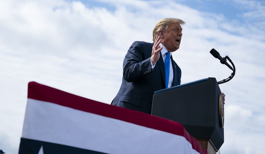 President Donald Trump speaks during a campaign rally at Pitt-Greenville Airport, Thursday, Oct. 15, 2020, in Greenville, N.C. (AP Photo/Evan Vucci)