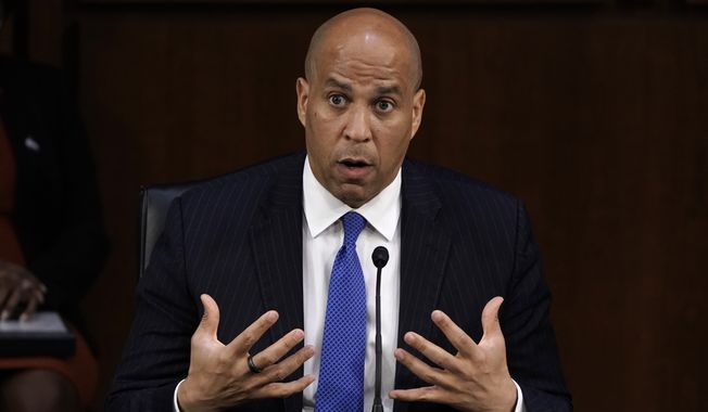 Sen. Cory Booker, D-N.J., speaks as the Senate Judiciary Committee hears from legal experts on the final day of the confirmation hearing for Supreme Court nominee Amy Coney Barrett, on Capitol Hill in Washington, Thursday, Oct. 15, 2020. (AP Photo/J. Scott Applewhite)