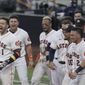 Players celebrate Houston Astros Carlos Correa&#39;s (1) walk off home run during the ninth inning in Game 5 of a baseball American League Championship Series, Tuesday, Dec. 15, 2020, in San Diego. The Astros defeated the Rays 4-3 and the Rays lead the series 3-2 games. (AP Photo/Gregory Bull)