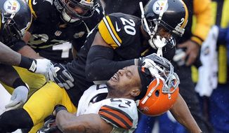 FILE  - In this Dec. 29, 2013, file photo, Cleveland Browns running back Edwin Baker (27) loses his helmet as he is tackled by Pittsburgh Steelers strong safety Will Allen (20) in the third quarter of an NFL football game in Pittsburgh. The Steelers won 20-7. Whether playing in Three Rivers Stadium or at Heinz Field, most of Cleveland&#x27;s trips down the Turnpike and across the Pennsylvania state line have not gone well. The Browns are just 6-41 on their visits to the Steel City since 1970. (AP Photo/Don Wright, File)