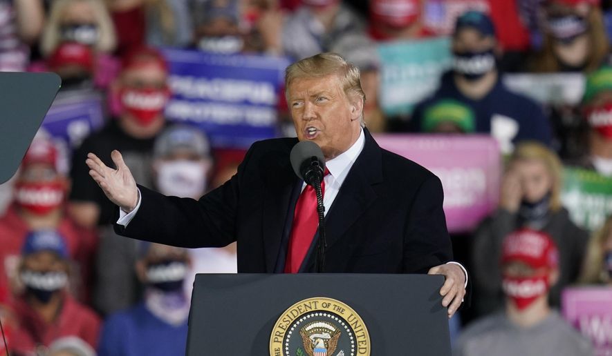 President Donald Trump speaks at a campaign rally at Des Moines International Airport, Wednesday, Oct. 14, 2020, in Des Moines, Iowa. (AP Photo/Charlie Neibergall)