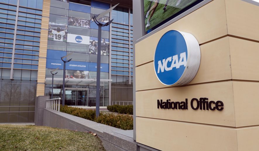 FILE - In this March 12, 2020, file photo, the national office of the NCAA in Indianapolis is shown. A set of proposals to permit NCAA athletes to earn money from endorsements and sponsorships deals will go up for vote in January, the last step for the association to change its rules but not the last word on how name, image and likeness compensation will work.   (AP Photo/Michael Conroy, File)