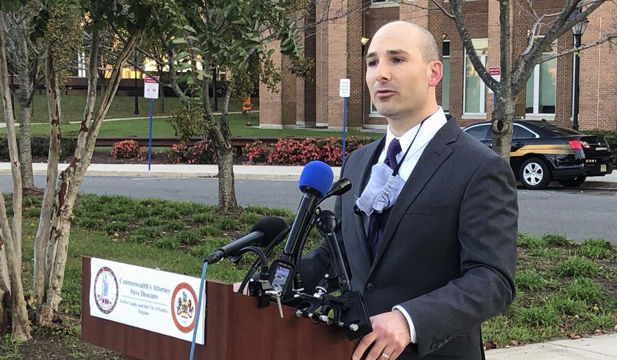 Fairfax County Commonwealth's Attorney Steve Descano speaks to reporters during a news conference outside the county courthouse in Fairfax, Va., Thursday, Oct. 15, 2020. (AP Photo/Matthew Barakat)
