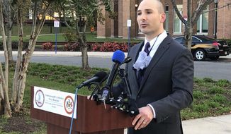 Fairfax County Commonwealth&#39;s Attorney Steve Descano announces during a news conference outside the county courthouse in Fairfax, Va., Thursday, Oct. 15, 2020, that two U.S. Park Police officers have been indicted on manslaughter charges in the 2017 shooting death of an unarmed motorist who led officers on a stop-and-go chase after an accident, The charges against officers Alejandro Amaya and Lucas Vinyard come after years of agitation by the family of Bijan Ghaisar, 25, of McLean, and some local and federal political figures who saw the officers&#39; conduct in the shooting as excessive. (AP Photo/Matthew Barakat)