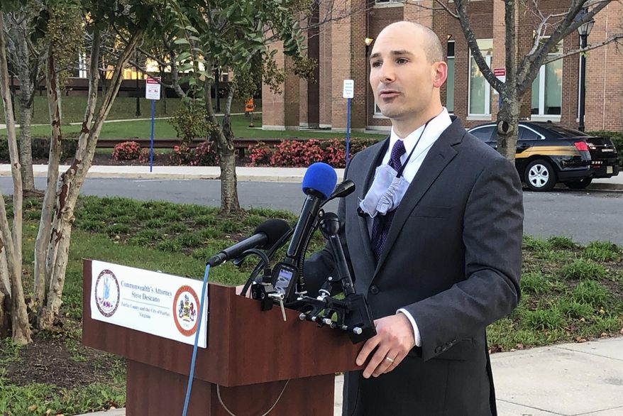 Fairfax County Commonwealth&#x27;s Attorney Steve Descano announces during a news conference outside the county courthouse in Fairfax, Va., Thursday, Oct. 15, 2020, that two U.S. Park Police officers have been indicted on manslaughter charges in the 2017 shooting death of an unarmed motorist who led officers on a stop-and-go chase after an accident, The charges against officers Alejandro Amaya and Lucas Vinyard come after years of agitation by the family of Bijan Ghaisar, 25, of McLean, and some local and federal political figures who saw the officers&#x27; conduct in the shooting as excessive. (AP Photo/Matthew Barakat)