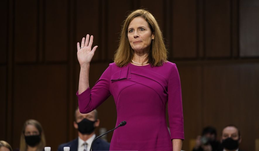 Supreme Court nominee Amy Coney Barrett is sworn in during a confirmation hearing before the Senate Judiciary Committee, Monday, Oct. 12, 2020, on Capitol Hill in Washington. (AP Photo/Patrick Semansky, Pool) ** FILE **