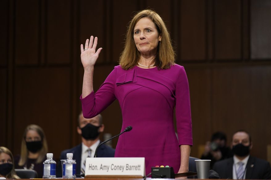 Supreme Court nominee Amy Coney Barrett is sworn in during a confirmation hearing before the Senate Judiciary Committee, Monday, Oct. 12, 2020, on Capitol Hill in Washington. (AP Photo/Patrick Semansky, Pool) ** FILE **