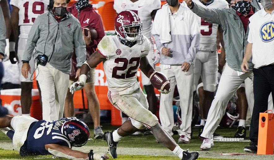 Alabama running back Najee Harris (22) runs past Mississippi linebacker MoMo Sanogo (46) during the second half of an NCAA college football game in Oxford, Miss., Saturday, Oct. 10, 2020. Alabama won 63-48. (AP Photo/Rogelio V. Solis)