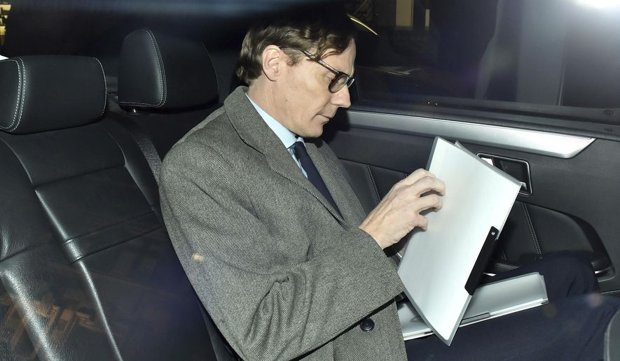 FILE - In this Tuesday March 20, 2018 file photo, Alexander Nix, chief executive of Cambridge Analytica, leaves his offices in central London. Documents released to The Associated Press in September 2020 from Brittany Kaiser, a former Cambridge Analytica insider, reveal what an election watchdog group claims was illegal coordination between Donald Trump’s 2016 presidential campaign and a pro-Trump PAC largely financed by billionaire Robert Mercer. On Thursday, Oct. 15, 2020, Nix’s attorney Kory Langhofer said his client had no knowledge of what is described in the complaint. (Dominic Lipinski/PA via AP)