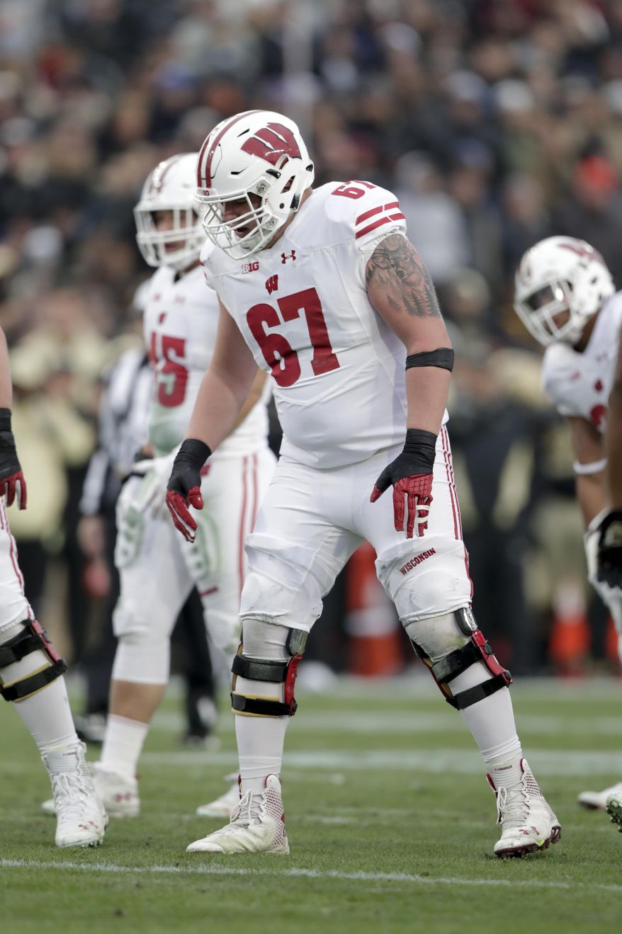 FILE- In this Nov. 17, 2018, file photo, Wisconsin offensive lineman Jon Dietzen (67) steps up to the line of scrimmage during the first half of an NCAA college football game against Purdue in West Lafayette, Ind. Dietzen spent much of his time away from football watching games and wondering how well he could still play if injuries hadn’t caused him to give it up. The response he got from family members sparked his decision to attempt a comeback. (AP Photo/Michael Conroy, File)