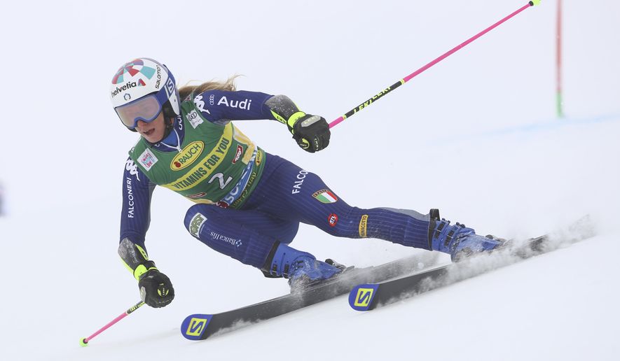 Italy's Marta Bassino speeds down the course during an alpine ski, women's World Cup giant slalom in Soelden, Austria, Saturday, Oct. 17, 2020. (AP Photo/Marco Trovati)