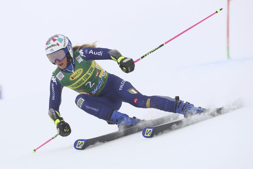 Italy's Marta Bassino speeds down the course during an alpine ski, women's World Cup giant slalom in Soelden, Austria, Saturday, Oct. 17, 2020. (AP Photo/Marco Trovati)