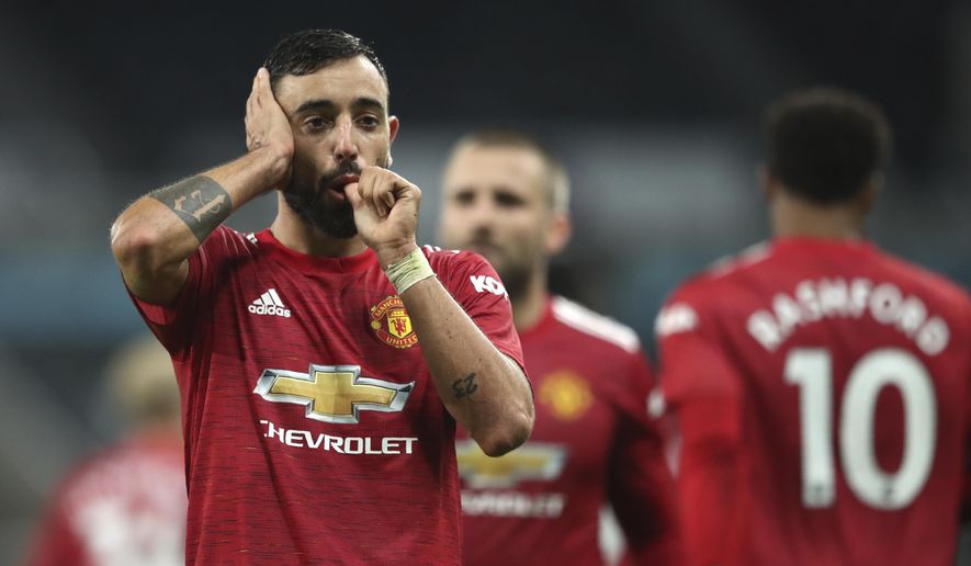 Manchester United&#39;s Bruno Fernandes celebrates after scoring the 2-1 lead during the English Premier League soccer match between Newcastle United and Manchester United at St. James&#39; Park in Newcastle, England, Saturday, Oct. 17, 2020. (Alex Pantling/Pool via AP)