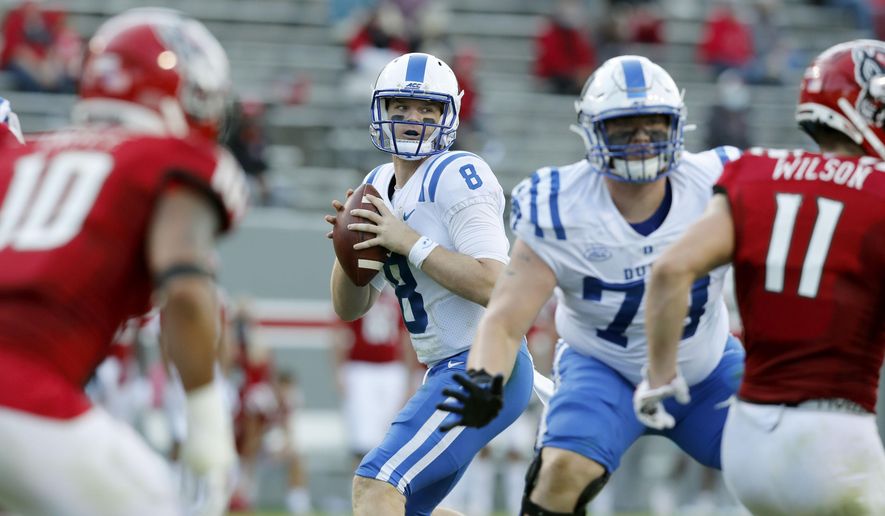 Duke quarterback Chase Brice (8) looks for a receiver during the first half of an NCAA college football game against North Carolina State at Carter-Finley Stadium in Raleigh, N.C., Saturday, Oct. 17, 2020. (Ethan Hyman/The News &amp;amp; Observer via AP)