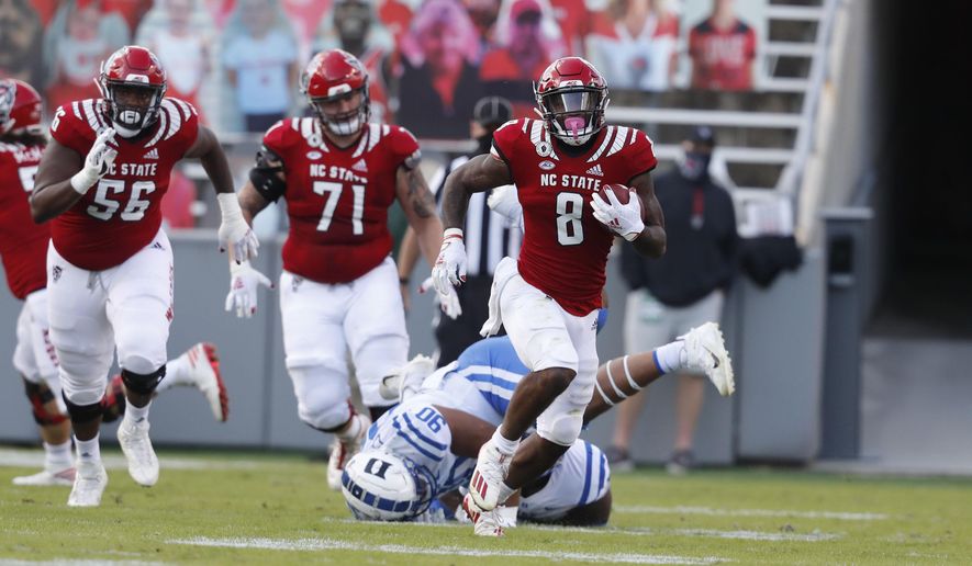 North Carolina State running back Ricky Person Jr. (8) runs against Duke during the first half of an NCAA college football game at Carter-Finley Stadium in Raleigh, N.C., Saturday, Oct. 17, 2020. (Ethan Hyman/The News &amp;amp; Observer via AP)