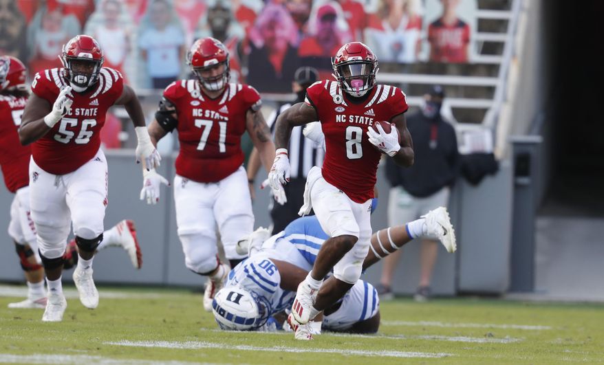 North Carolina State running back Ricky Person Jr. (8) runs against Duke during the first half of an NCAA college football game at Carter-Finley Stadium in Raleigh, N.C., Saturday, Oct. 17, 2020. (Ethan Hyman/The News & Observer via AP)