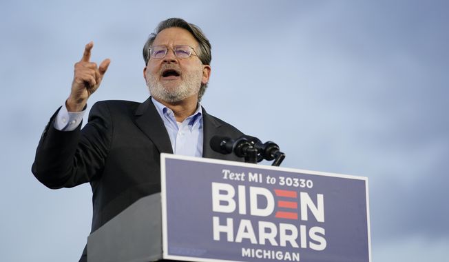 Sen. Gary Peters, D-Mich., speaks during an event for Democratic presidential candidate former Vice President Joe Biden at Michigan State Fairgrounds in Novi, Mich., Friday, Oct. 16, 2020. (AP Photo/Carolyn Kaster)