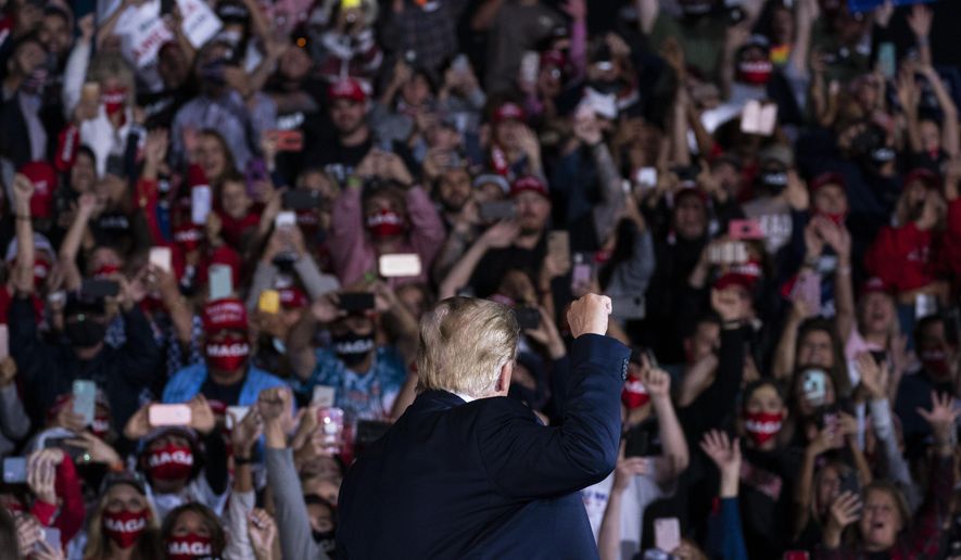 President Donald Trump arrives to speak to a campaign rally at Middle Georgia Regional Airport, Friday, Oct. 16, 2020, in Macon, Ga. (AP Photo/Evan Vucci)