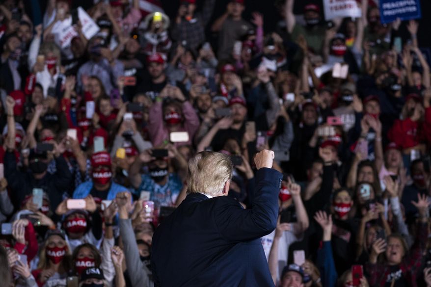 President Donald Trump arrives to speak to a campaign rally at Middle Georgia Regional Airport, Friday, Oct. 16, 2020, in Macon, Ga. (AP Photo/Evan Vucci)