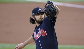 Atlanta Braves starting pitcher Ian Anderson throws against the Los Angeles Dodgers during the first inning in Game 2 of a baseball National League Championship Series Tuesday, Oct. 13, 2020, in Arlington, Texas. (AP Photo/Tony Gutierrez)