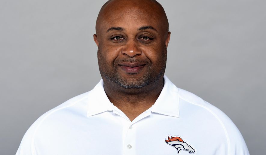 This is a 2019 photo of Curtis Modkins of the Denver Broncos NFL football team. Modkins has tested positive for COVID-19 and won’t accompany the team on its trip to New England. The Broncos said they learned of Modkins’ diagnosis early Saturday, Oct. 17, 2020. (AP Photo/File)