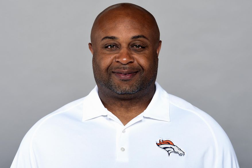 This is a 2019 photo of Curtis Modkins of the Denver Broncos NFL football team. Modkins has tested positive for COVID-19 and won’t accompany the team on its trip to New England. The Broncos said they learned of Modkins’ diagnosis early Saturday, Oct. 17, 2020. (AP Photo/File)