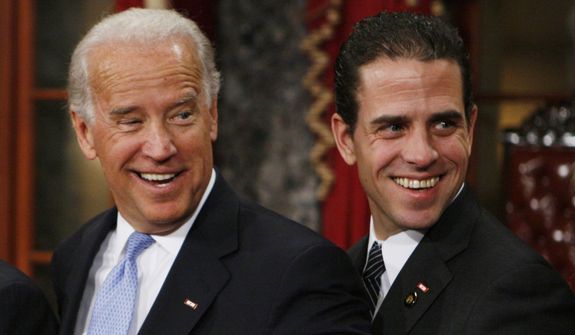 In this file photo from 2009, then-Vice President-elect, Sen. Joe Biden, D-Del., left, stands with his son Hunter during a re-enactment of the Senate oath ceremony, Tuesday, Jan. 6, 2009, in the Old Senate Chamber on Capitol Hill in Washington. (AP Photo/Charles Dharapak) ** FILE **