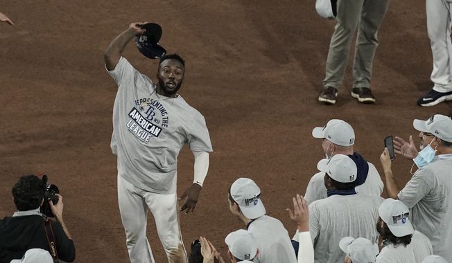 Tampa Bay Rays left fielder Randy Arozarena celebrates his MVP award following their victory against the Houston Astros in Game 7 of a baseball American League Championship Series, Saturday, Oct. 17, 2020, in San Diego. The Rays defeated the Astros 4-2 to win the series 4-3 games. (AP Photo/Jae C. Hong)


