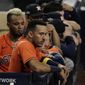 Houston Astros Carlos Correa watches the eighth inning from the dugout in Game 7 of a baseball American League Championship Series, Saturday, Oct. 17, 2020, in San Diego. (AP Photo/Gregory Bull)